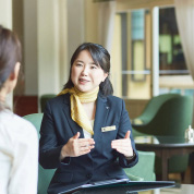 A female concierge giving a tour